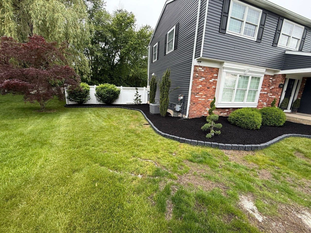 Project Transform Your Yard with Expert Mulching and Lawn Care image